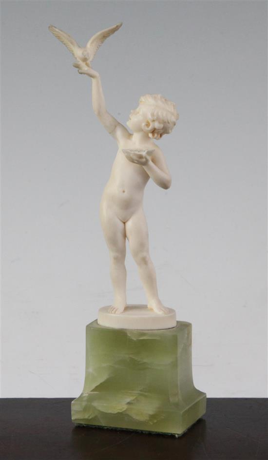Ferdinand Preiss (German, 1882-1943). An Art Deco carved ivory figure of a young girl feeding a bird, 7.5in.